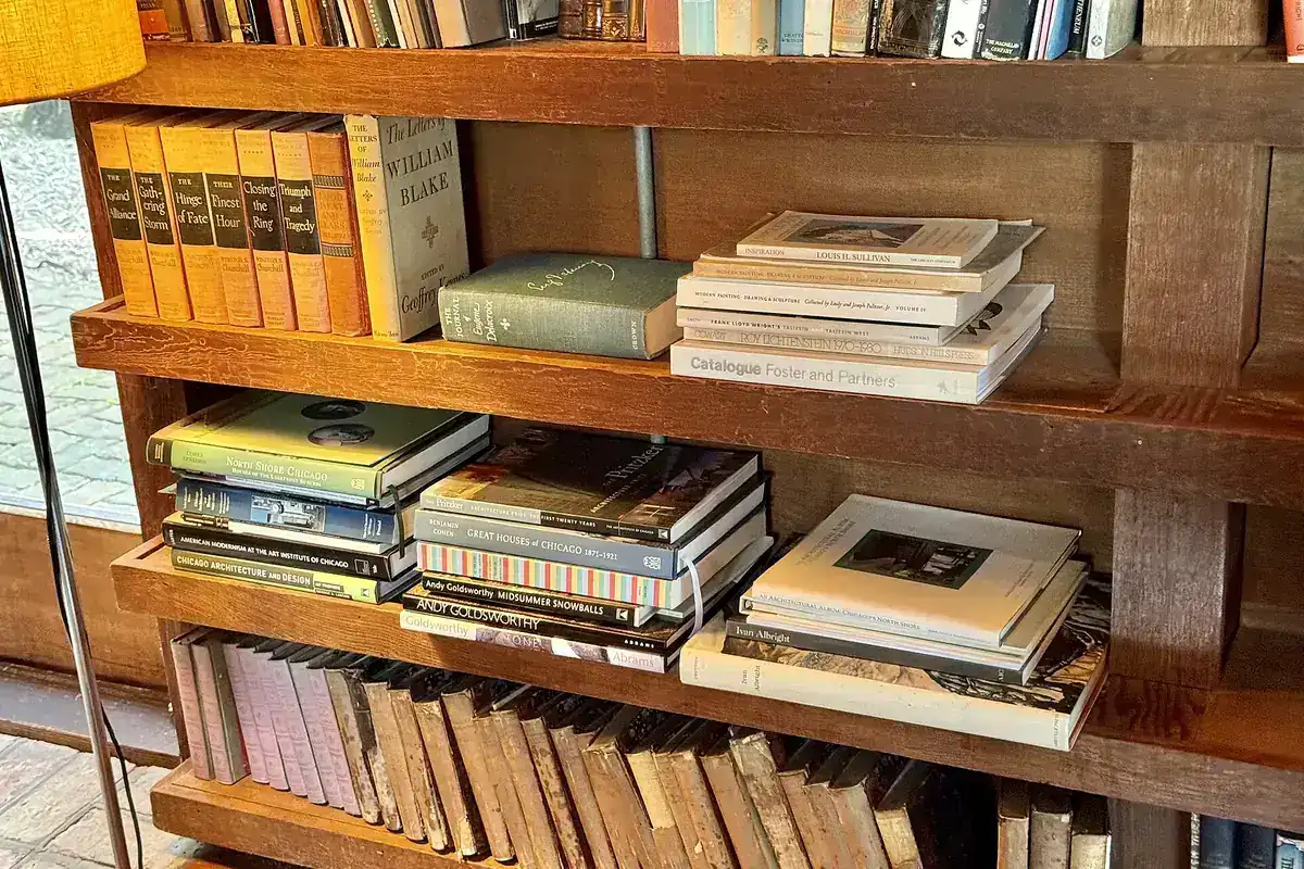 Fitted timber shelving holding books and reference material, representing the guide library for cabinet work in Riverside CA