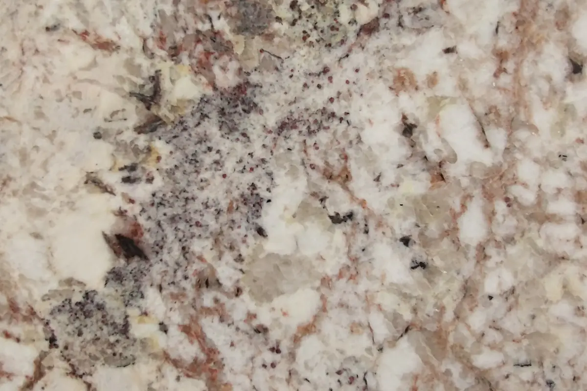 Large stone slabs stood upright in a rack showing their grain and colour variation