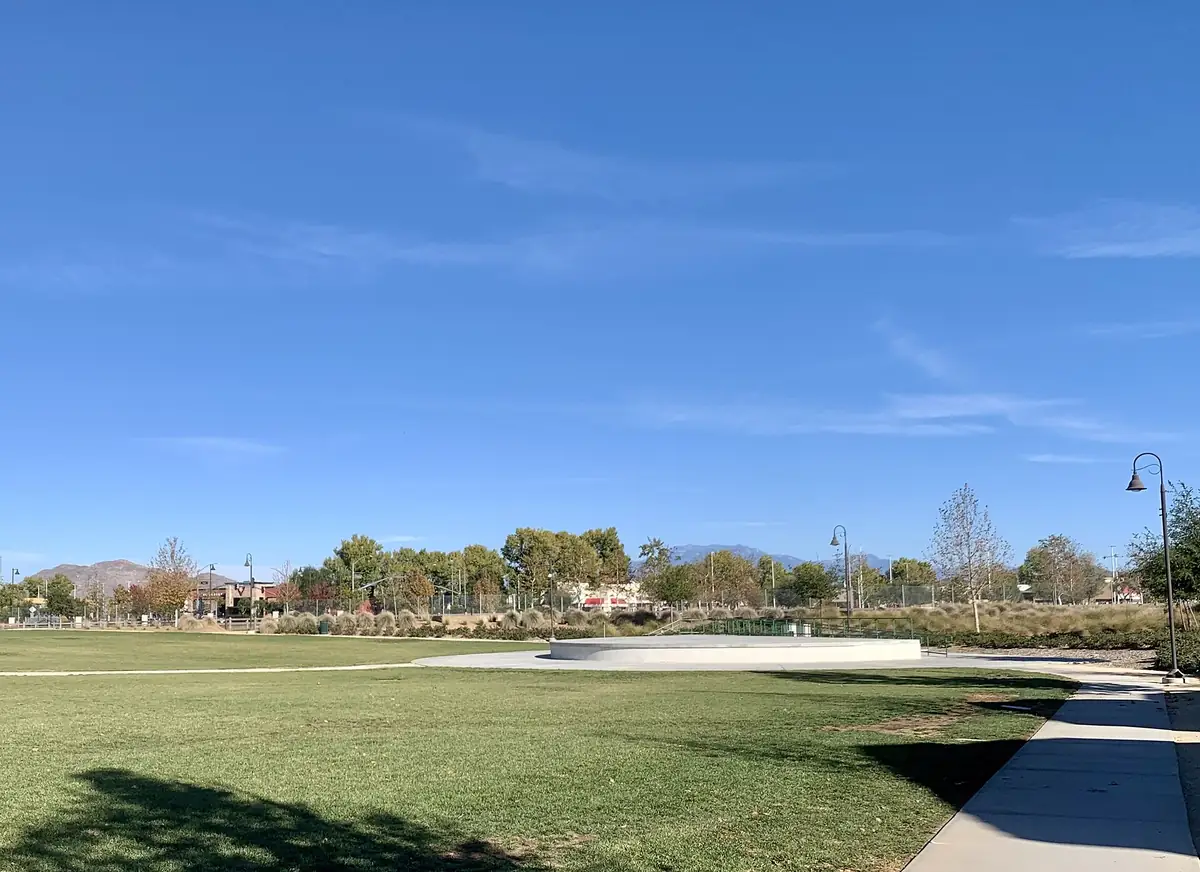 Central Park in Menifee California, an open green park with mountains visible in the distance