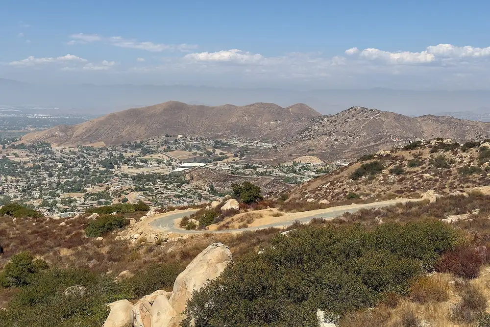 A view from hills above Norco California across the valley, showing low density detached housing and open ground